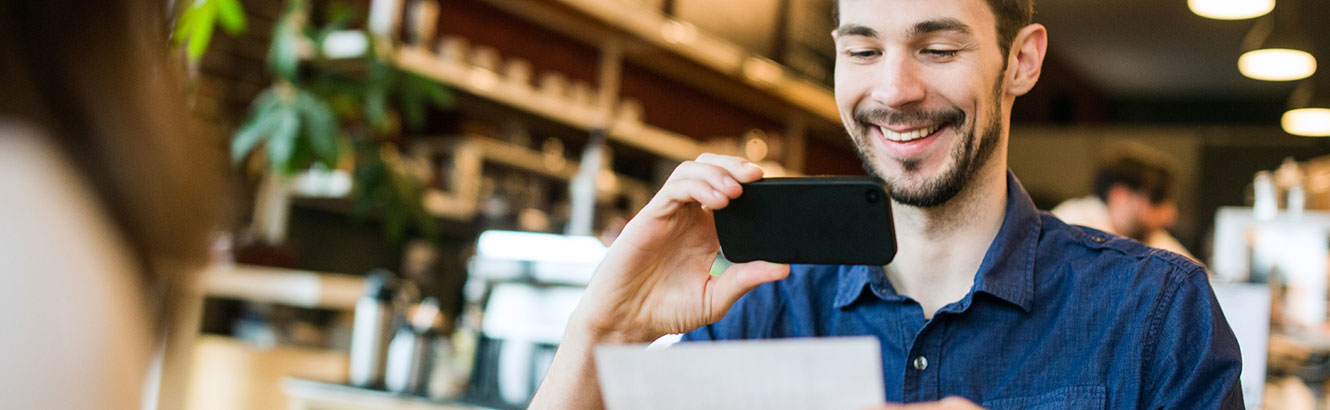 Man depositing check with phone